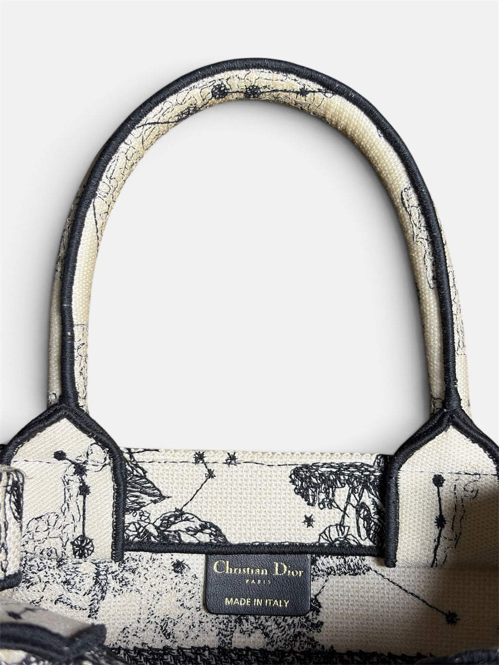 Last Season Christian Dior Book Tote in cream canvas with black celestial embroidery and signature logo patch