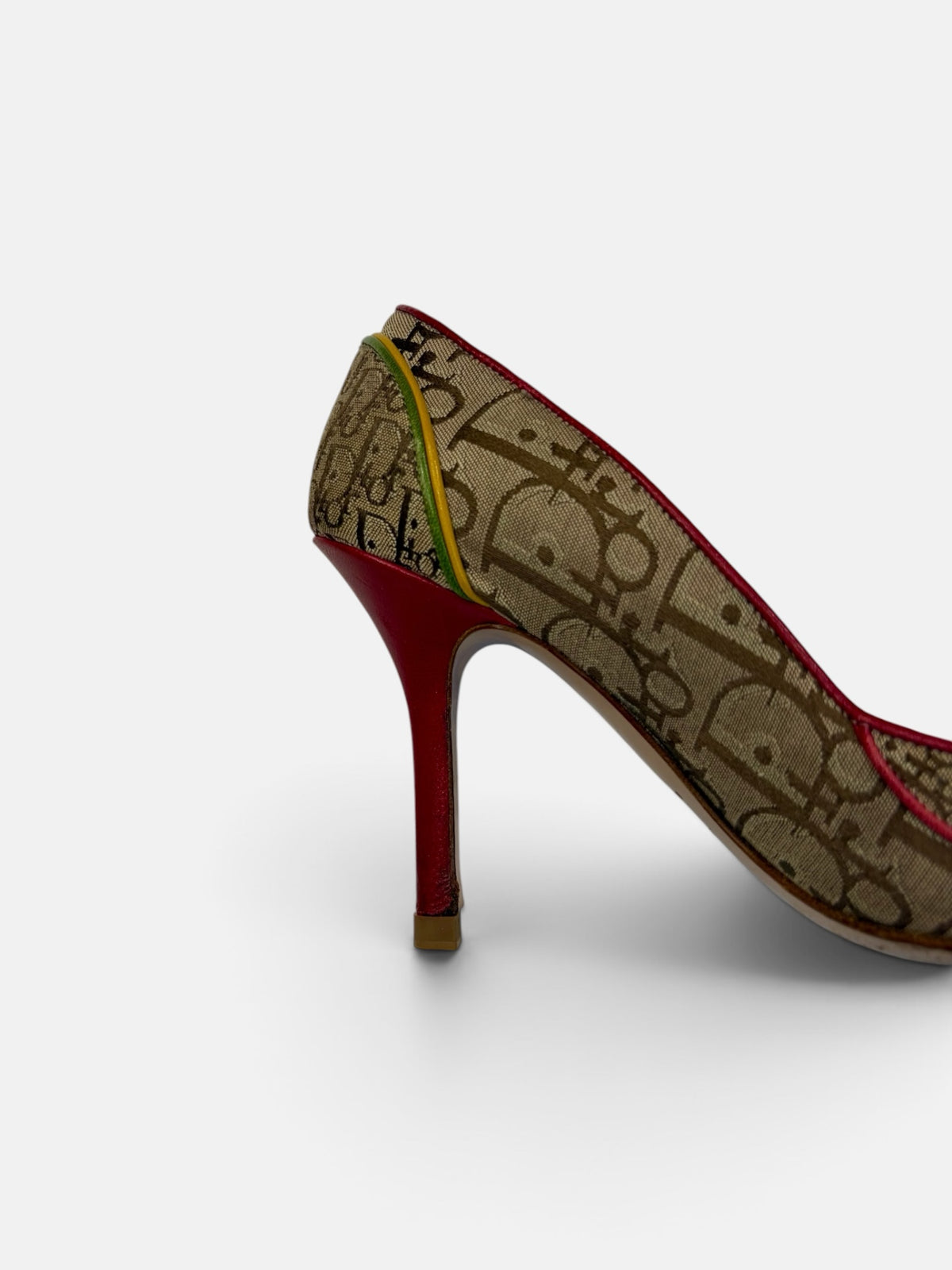 Last Season vintage Dior monogram canvas stiletto pumps with red leather heel and yellow green trim detail