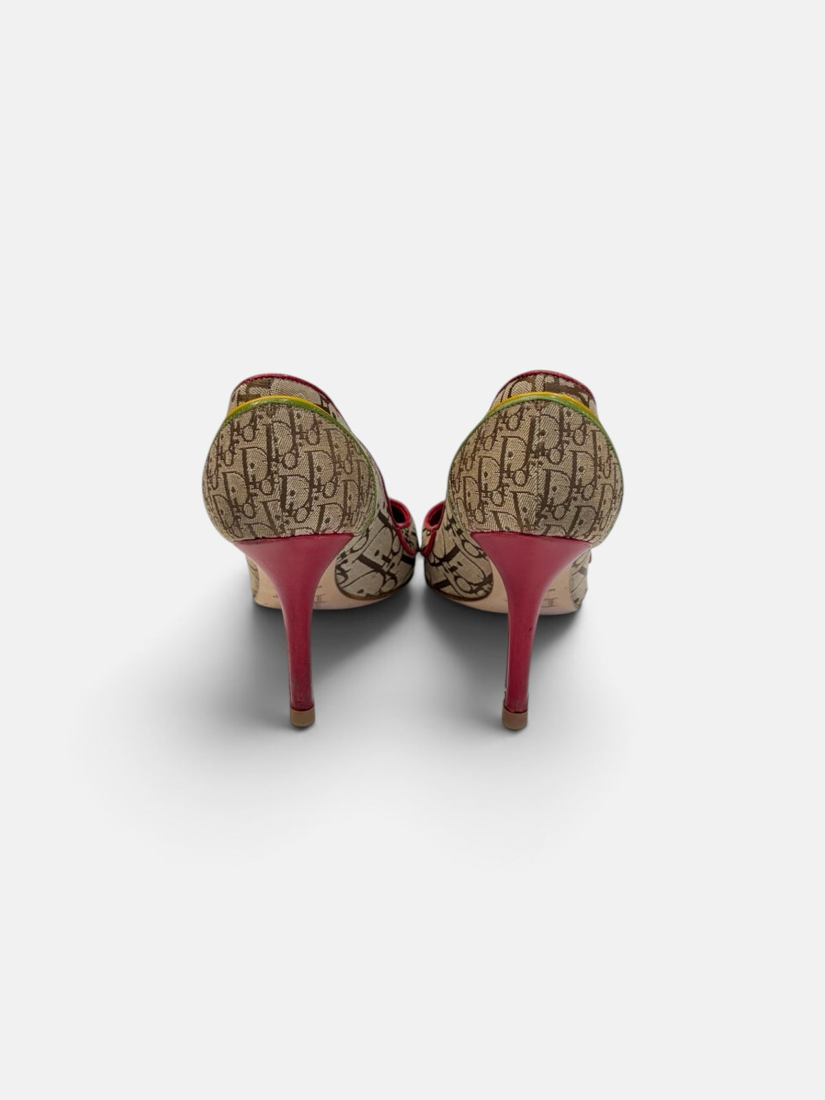 Last Season vintage Dior monogram canvas stiletto pumps with red heels and green trim, back view