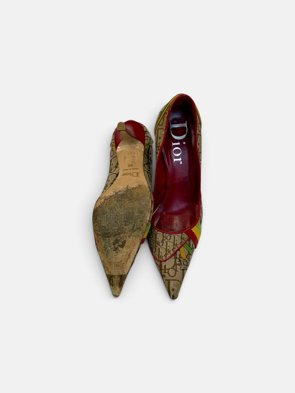 Last Season vintage Dior monogram canvas pointed toe stiletto pumps with red leather lining and multicolor accents.