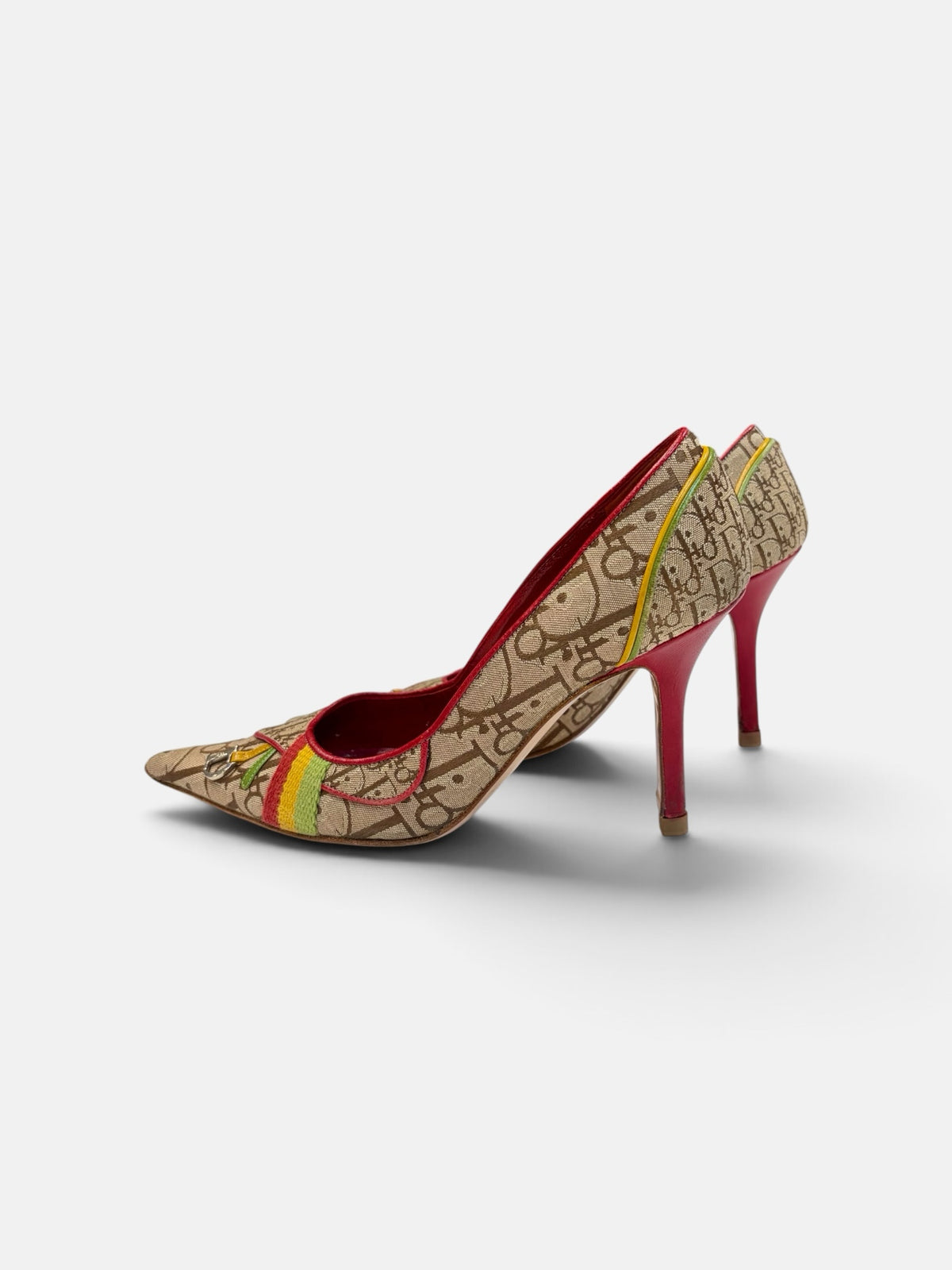 Last Season vintage Dior monogram canvas pointed toe stiletto pumps with red, yellow, and green accents