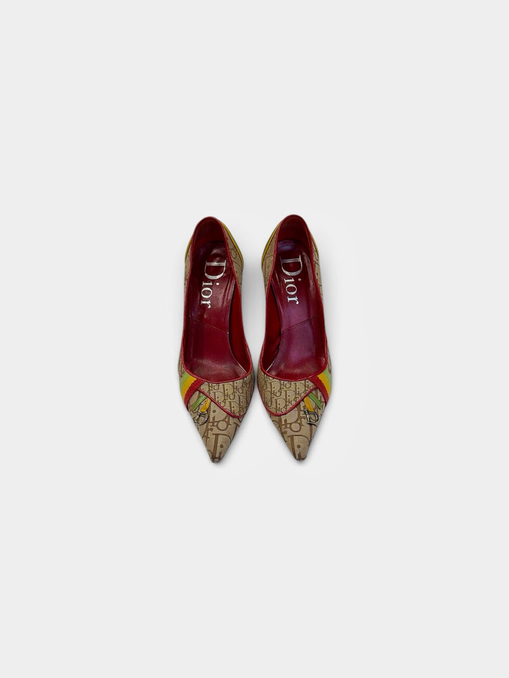 Last Season vintage Dior pointed toe stiletto pumps in monogram canvas with red, yellow, and green accents.