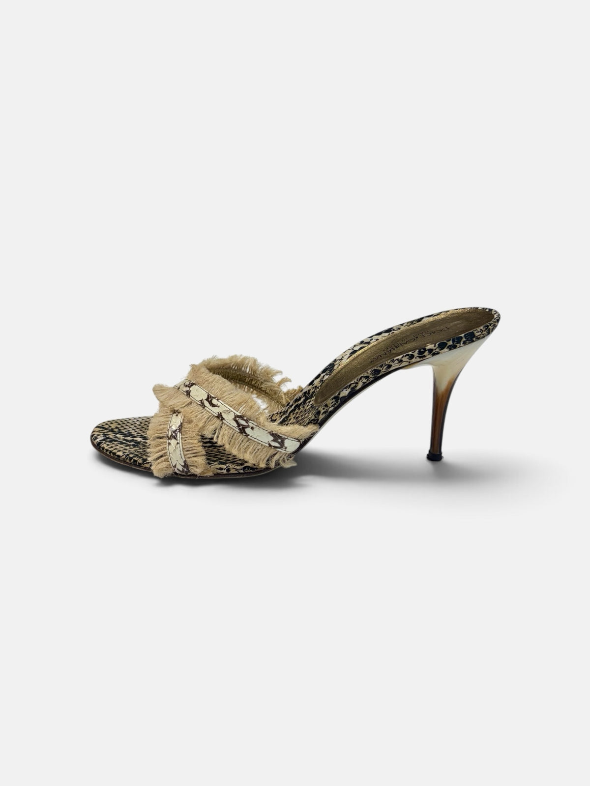 Last Season Dolce & Gabbana snakeskin-print high heel mules with crossover straps and frayed fringe detailing.