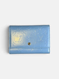 Last Season Louis Vuitton blue patent leather wallet with embossed Monogram pattern and gold snap button closure